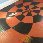 red-black-spiral-chequerboard-painted-floor